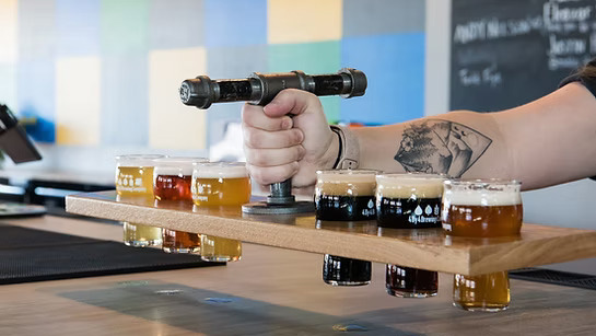 A stack of beer samples from 4 By 4 Brewing Company.