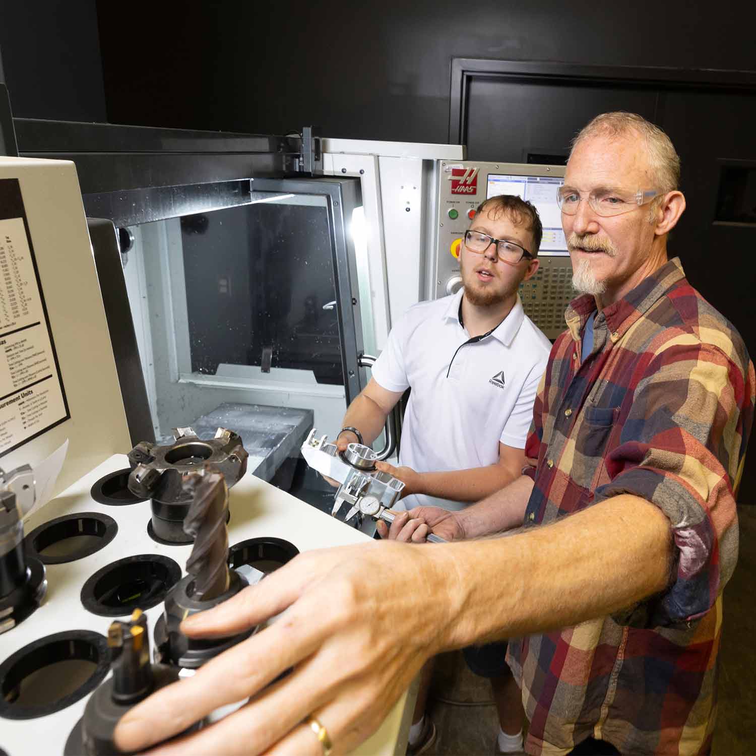 Two people working together in a lab at the Efactory.