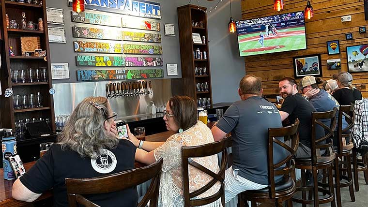 Bar patrons enjoying beer at Transparent Brewing Company.
