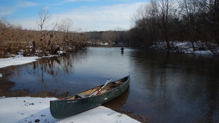 Canoe on Big River in winter.